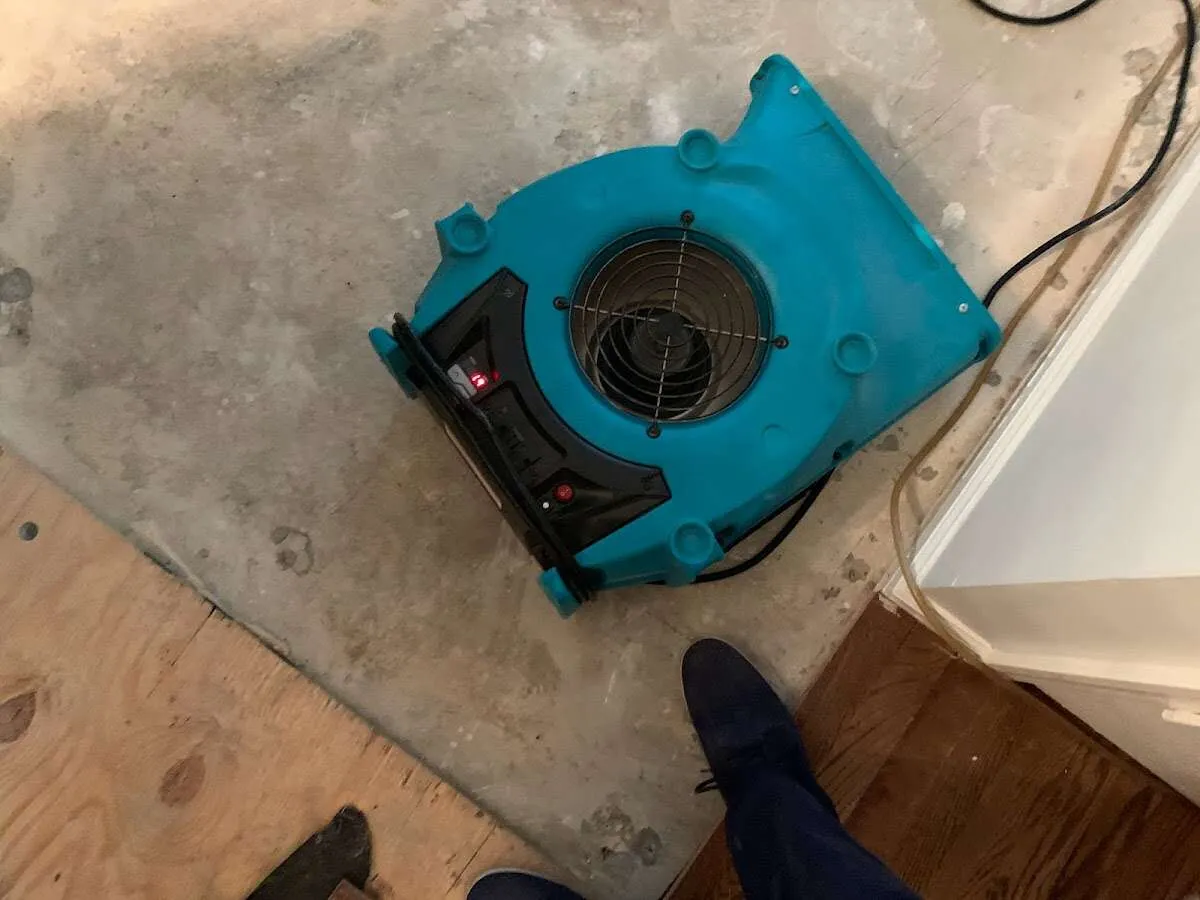 Air mover drying subfloor during Leak Detection & Repair in San Diego